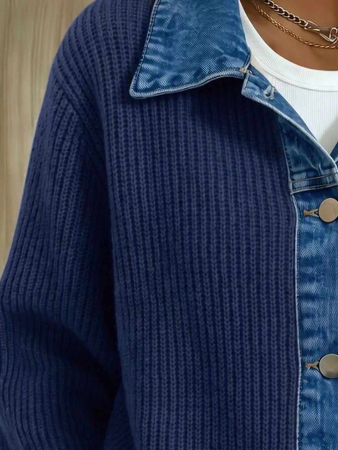 Close-up of the navy cardigan sleeve and denim collar