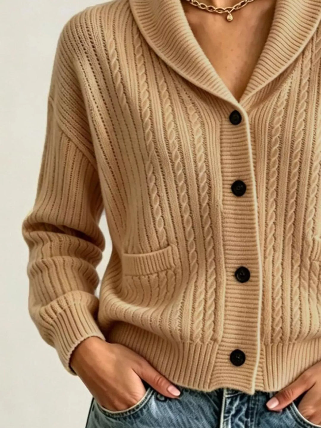 Close-up of the camel cardigan with shawl collar, buttons and ribbed cuffs