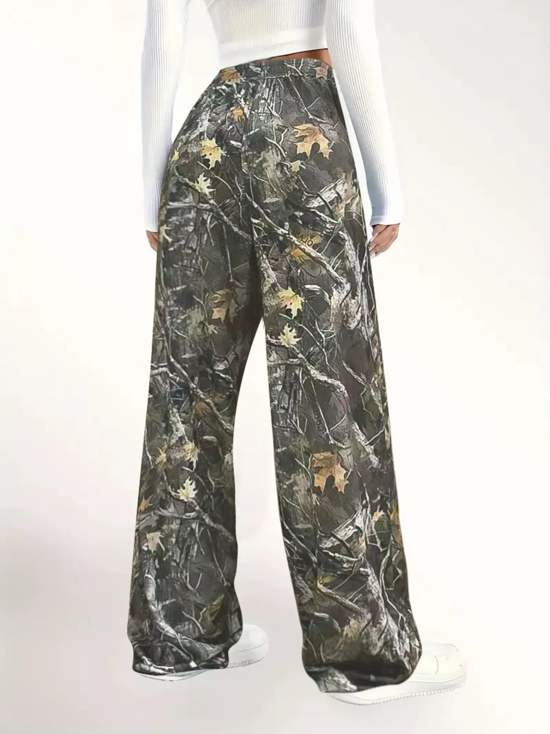 Back view of the camo wide leg pants with white sneakers