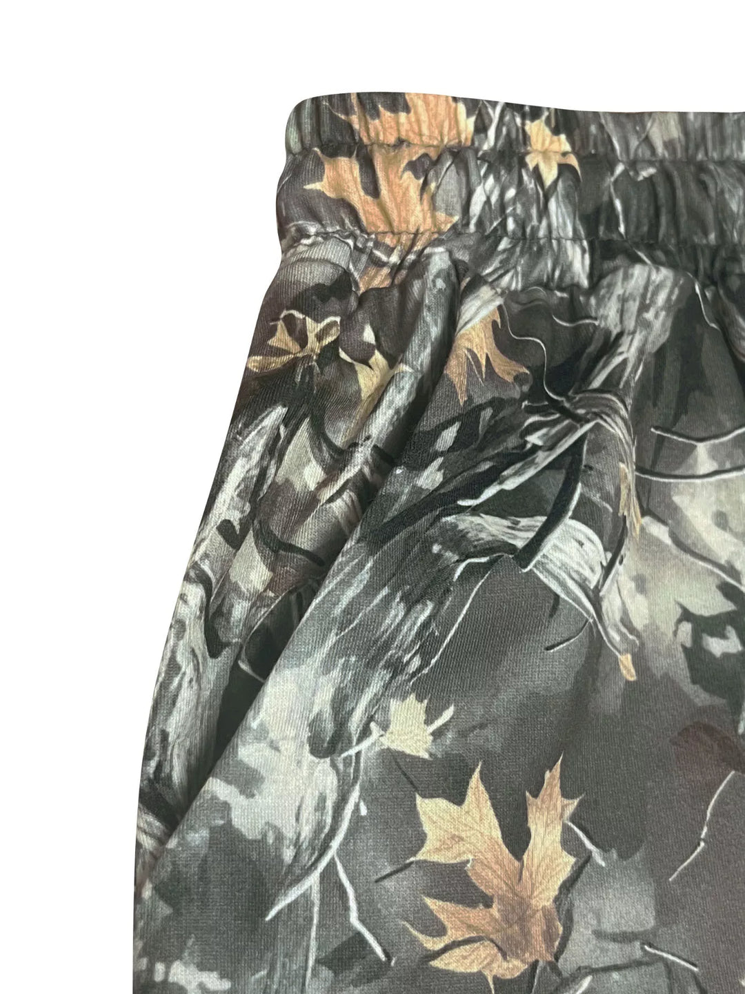 Close-up of the camo pants waistband and pocket with leaf pattern