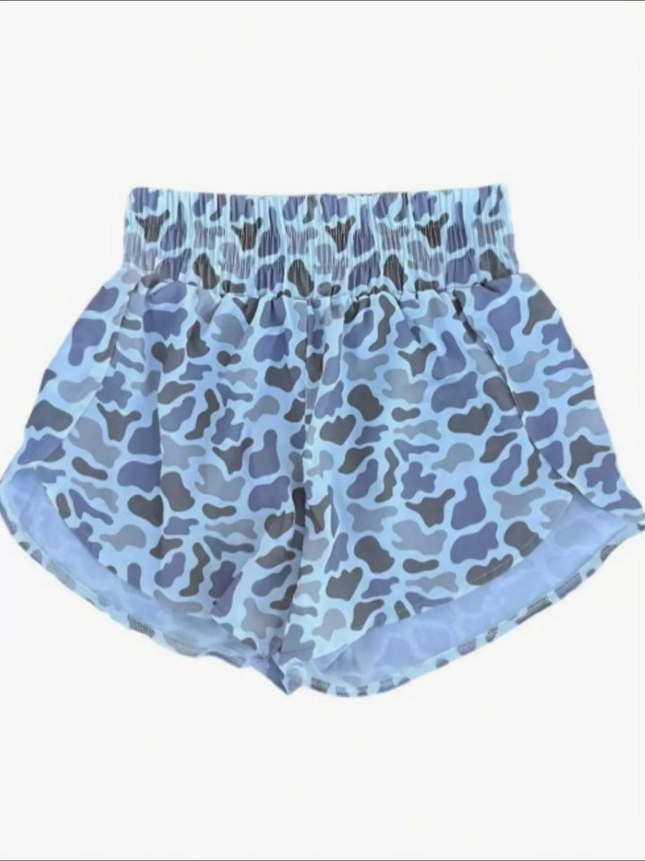 Blue camo shorts flat view showing the elastic waist and curved tulip hem