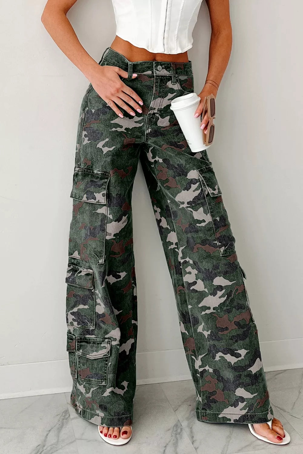Women's camouflage pants in green camo, wide leg cargo style, front view