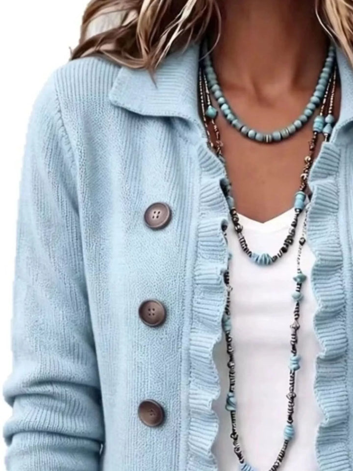 Light blue ruffle edge cardigan close-up of the collar and buttons