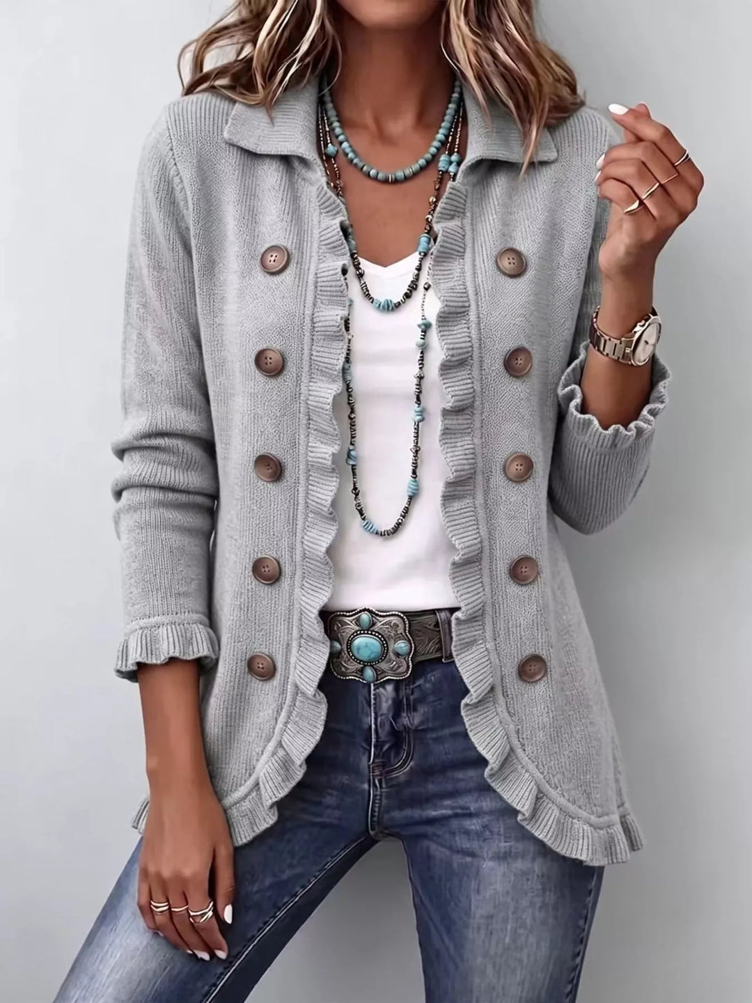 Light gray button front cardigan with collar and ruffle trim, over a white top