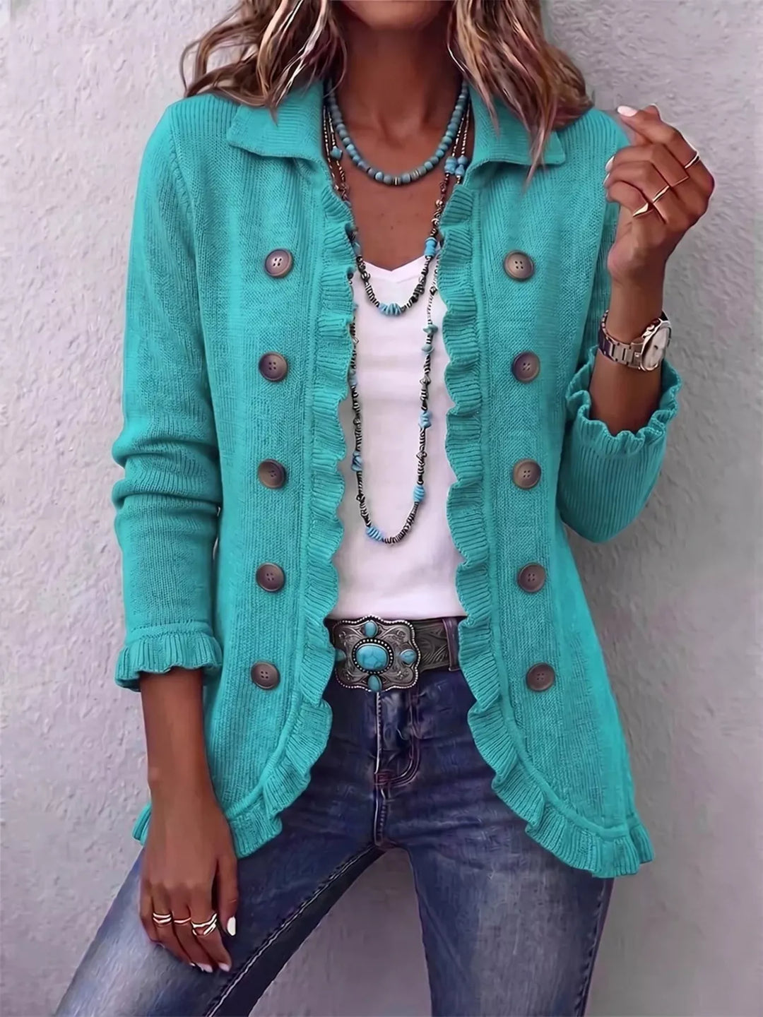 Teal cardigan with ruffle trim and button front, worn with a belt and jeans