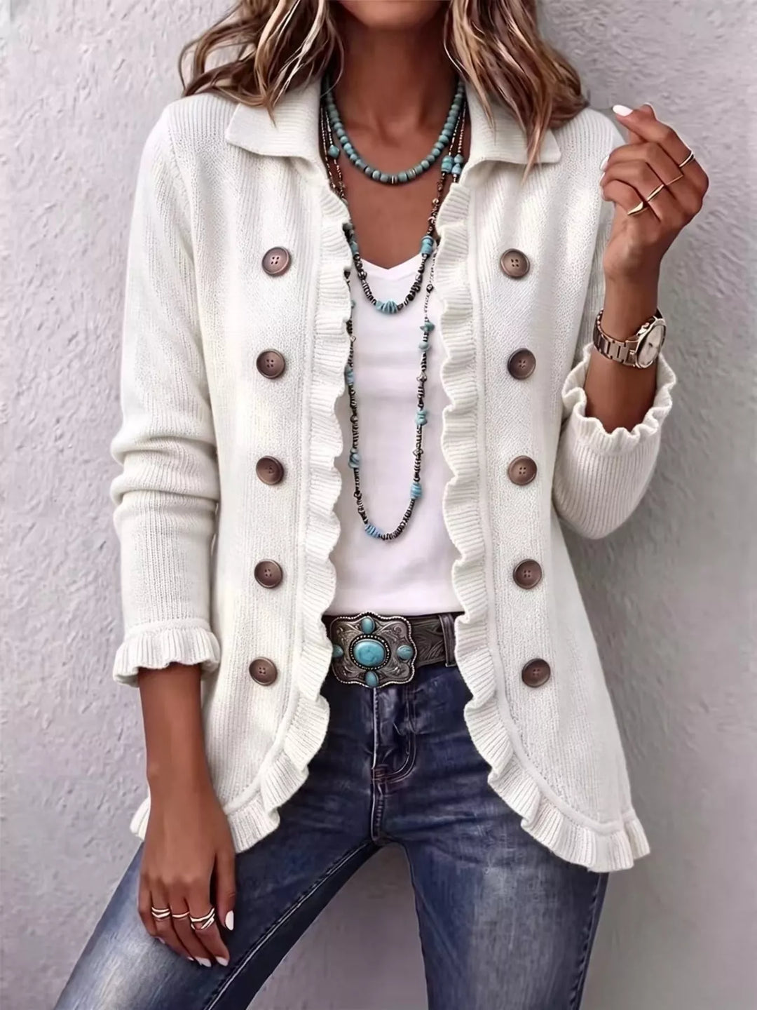 White button front cardigan with collar and ruffle trim, styled with jeans