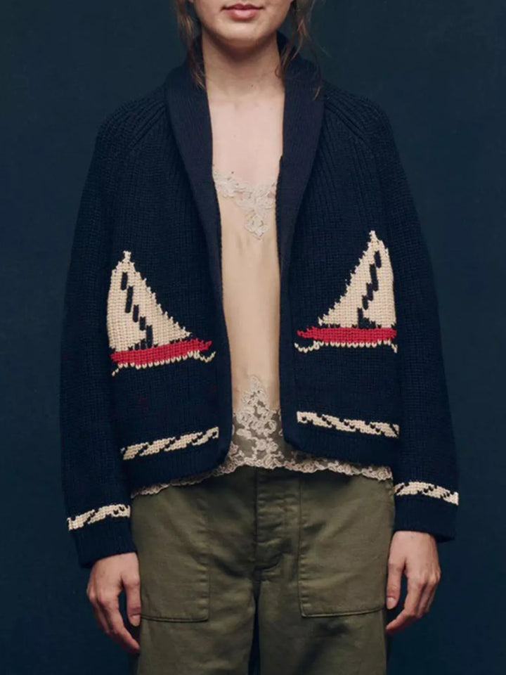 Front view of the navy shawl collar cardigan with twisted rope trim at the hem