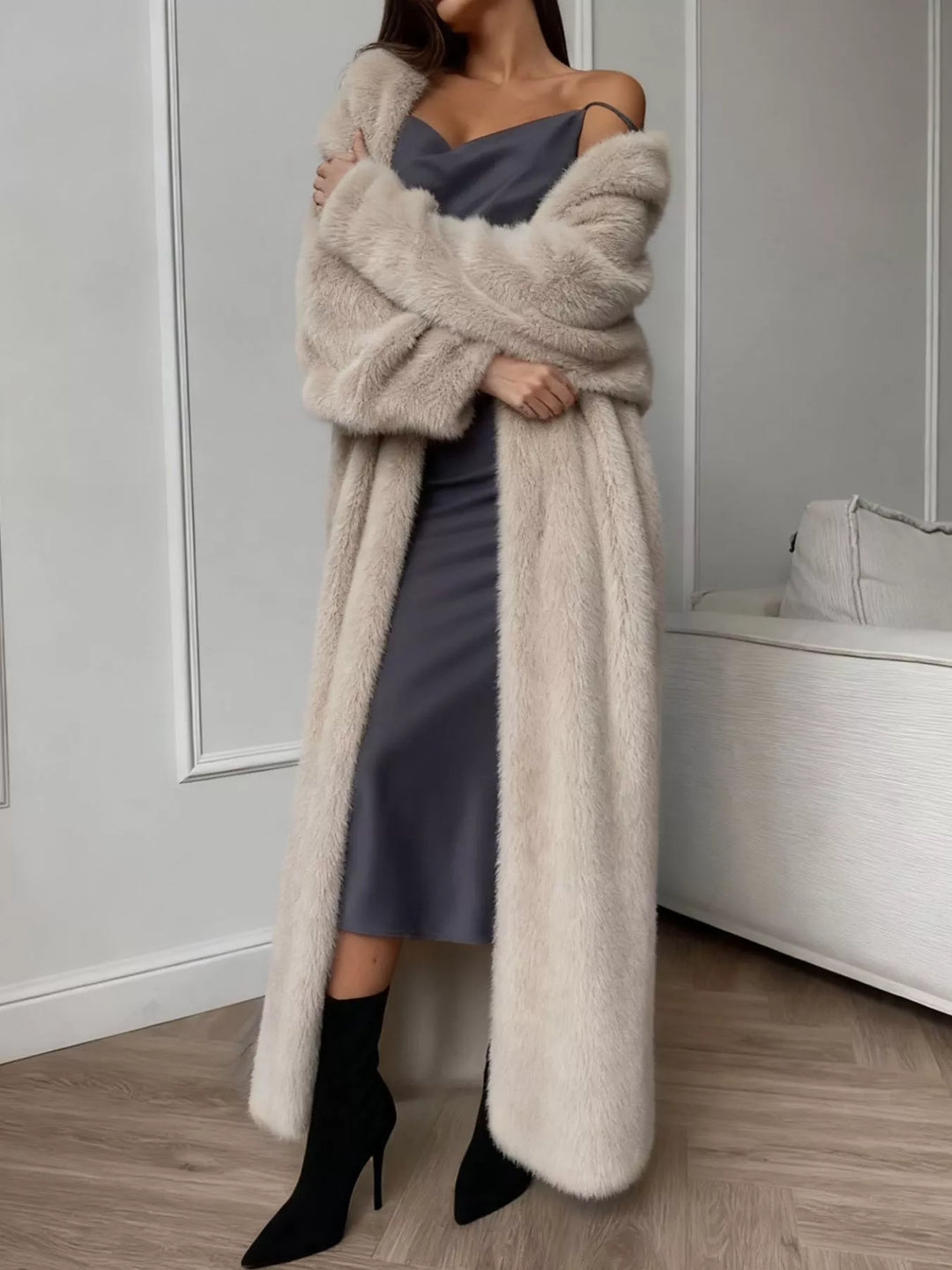 Full length beige longline cardigan styled with black ankle boots