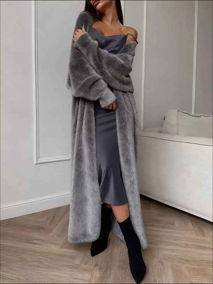 Full length gray longline cardigan styled with black ankle boots