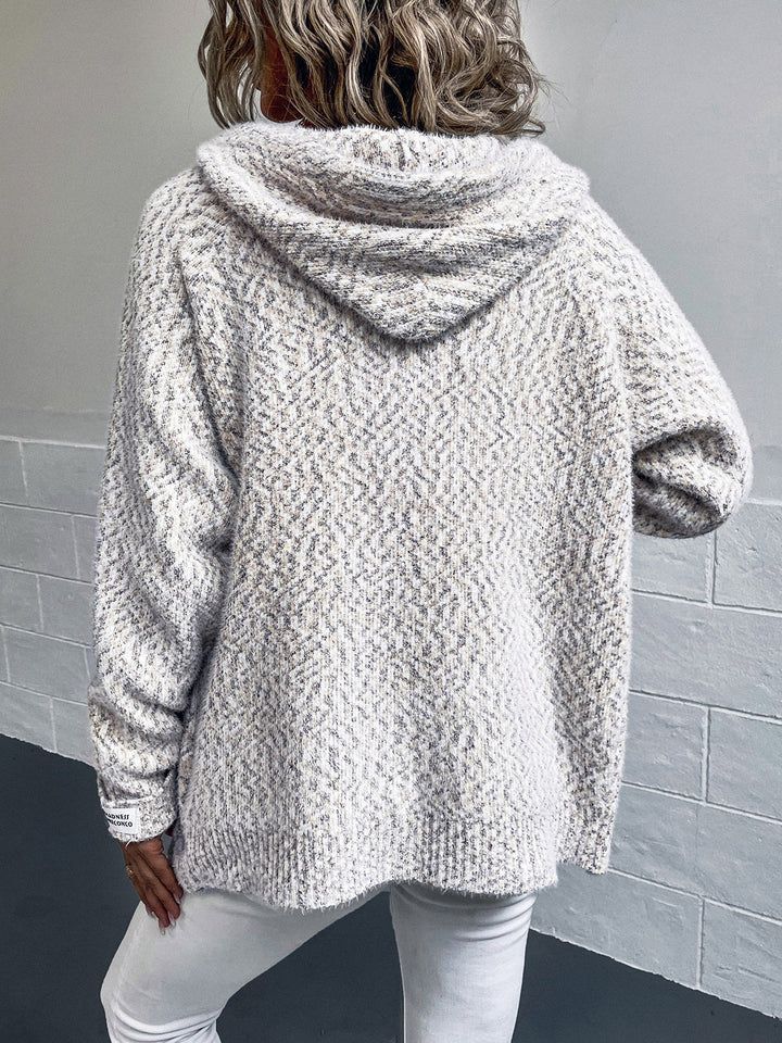 Back view of beige hooded cardigan with relaxed fit