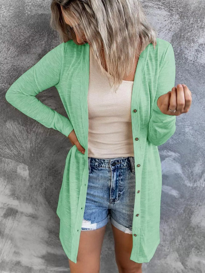 mint button front longline cardigan paired with denim shorts, front pose