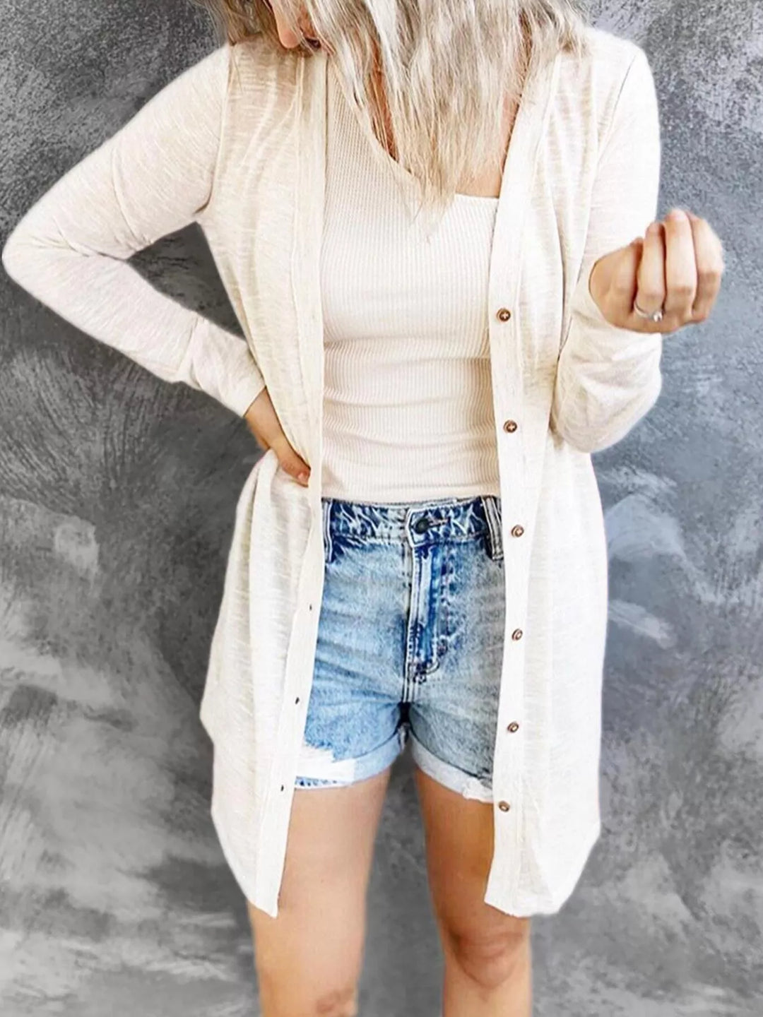 Women's cardigan in white, lightweight longline button front, worn with denim shorts