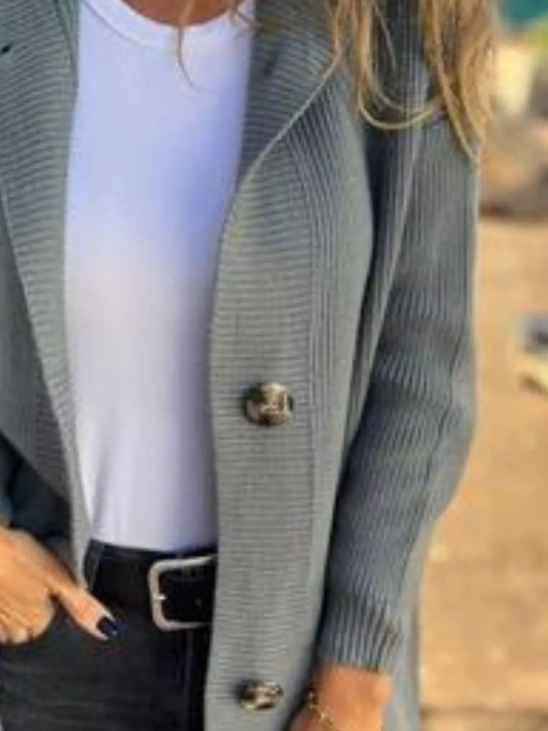 Close-up of the sage cardigan ribbed placket and large buttons