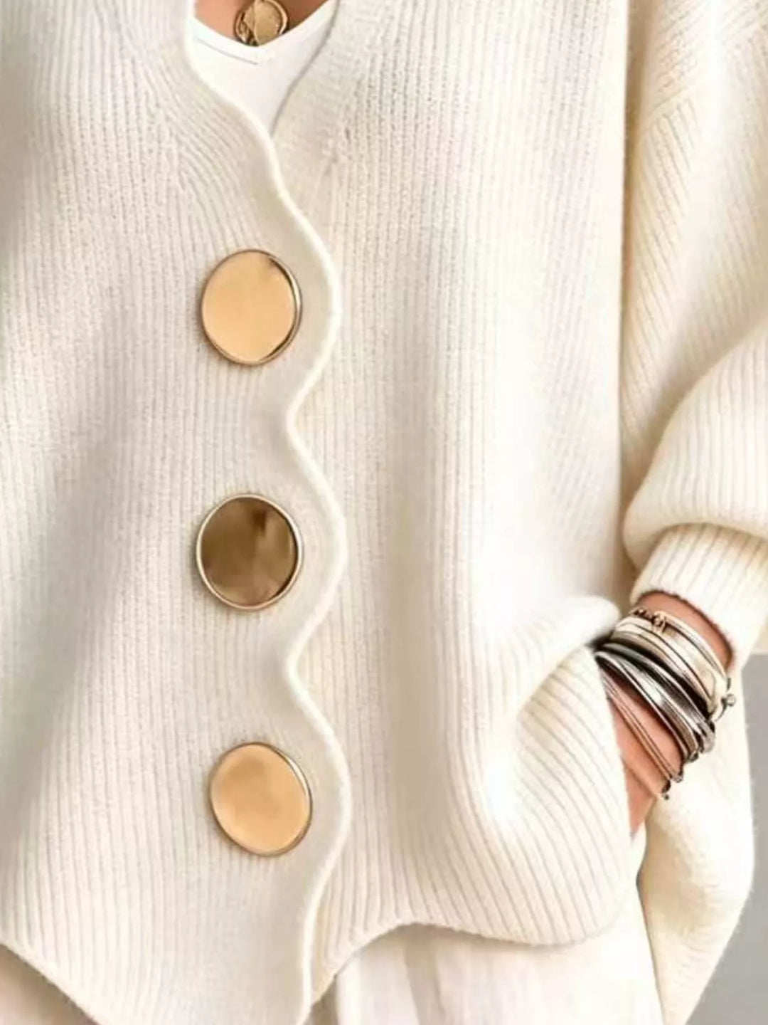 Cream cardigan button front and scalloped hem, hand in pocket detail