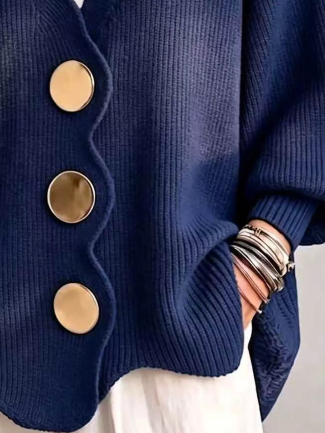 Navy cardigan button front and scalloped hem, hand in pocket detail