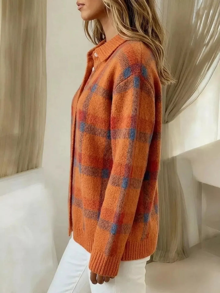 Side view of the orange plaid cardigan with a button front