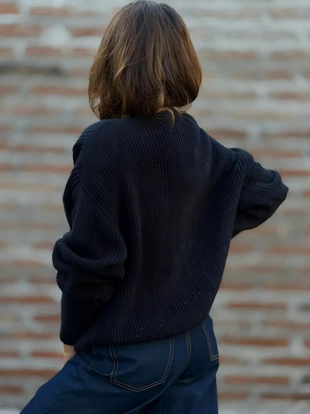Back view of the black ribbed knit cardigan