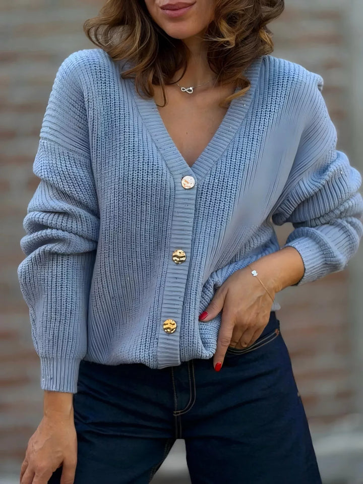Dusty blue ribbed V neck cardigan with gold buttons, front view