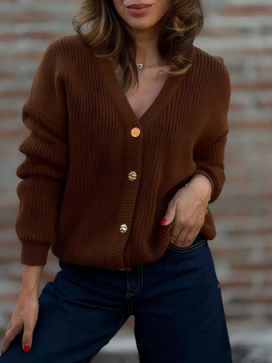 Rust brown ribbed knit cardigan with V neck and button front