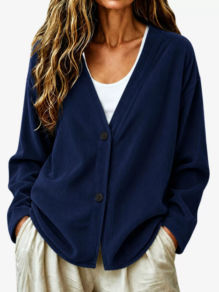 Corduroy-look ribbed v-neck button up in dark blue, front view