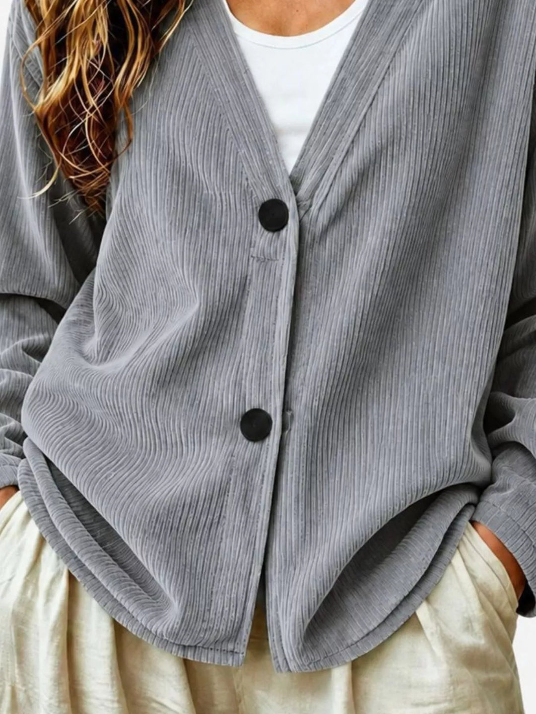 Corduroy-look ribbed v-neck button up in gray, close-up detail