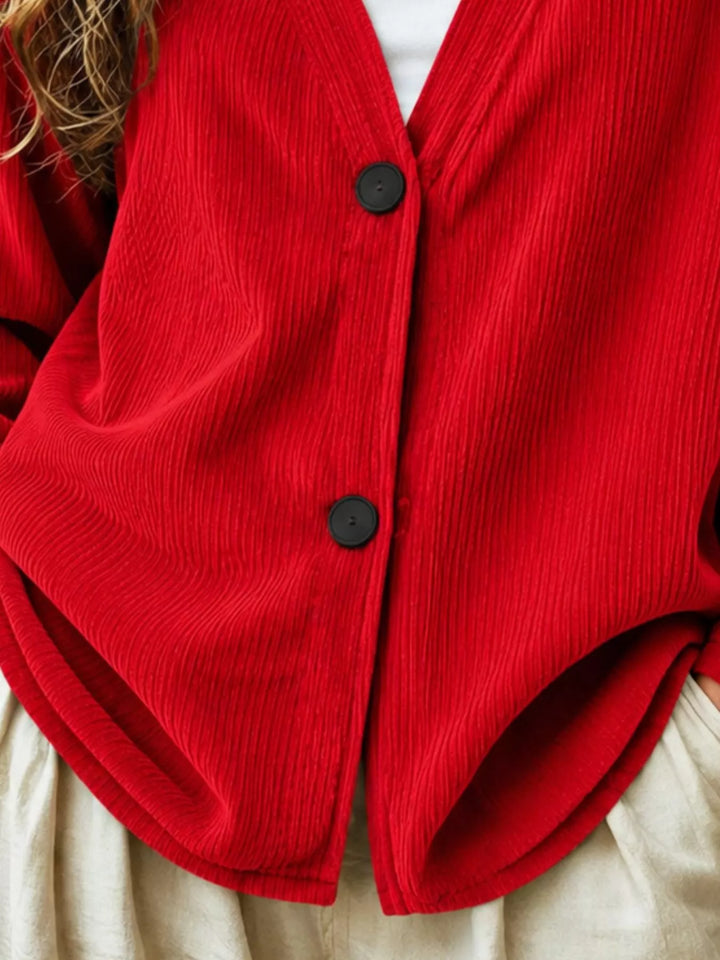 Corduroy-look ribbed v-neck button up in scarlet, close-up detail