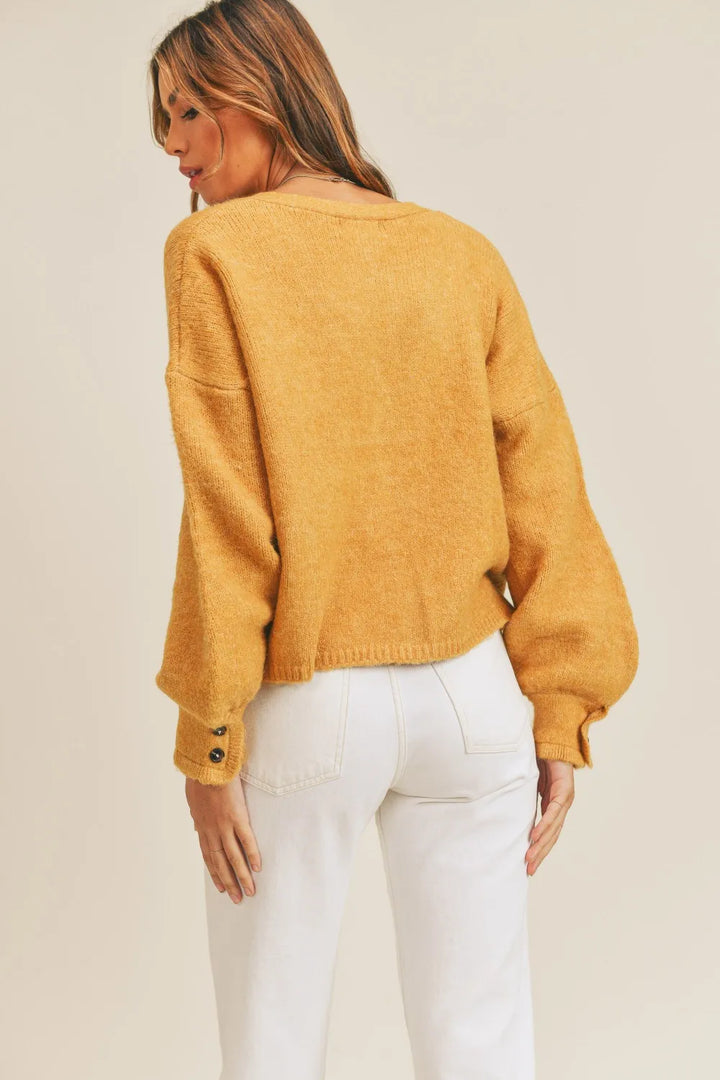 Cropped v-neck balloon sleeve in mustard, back view