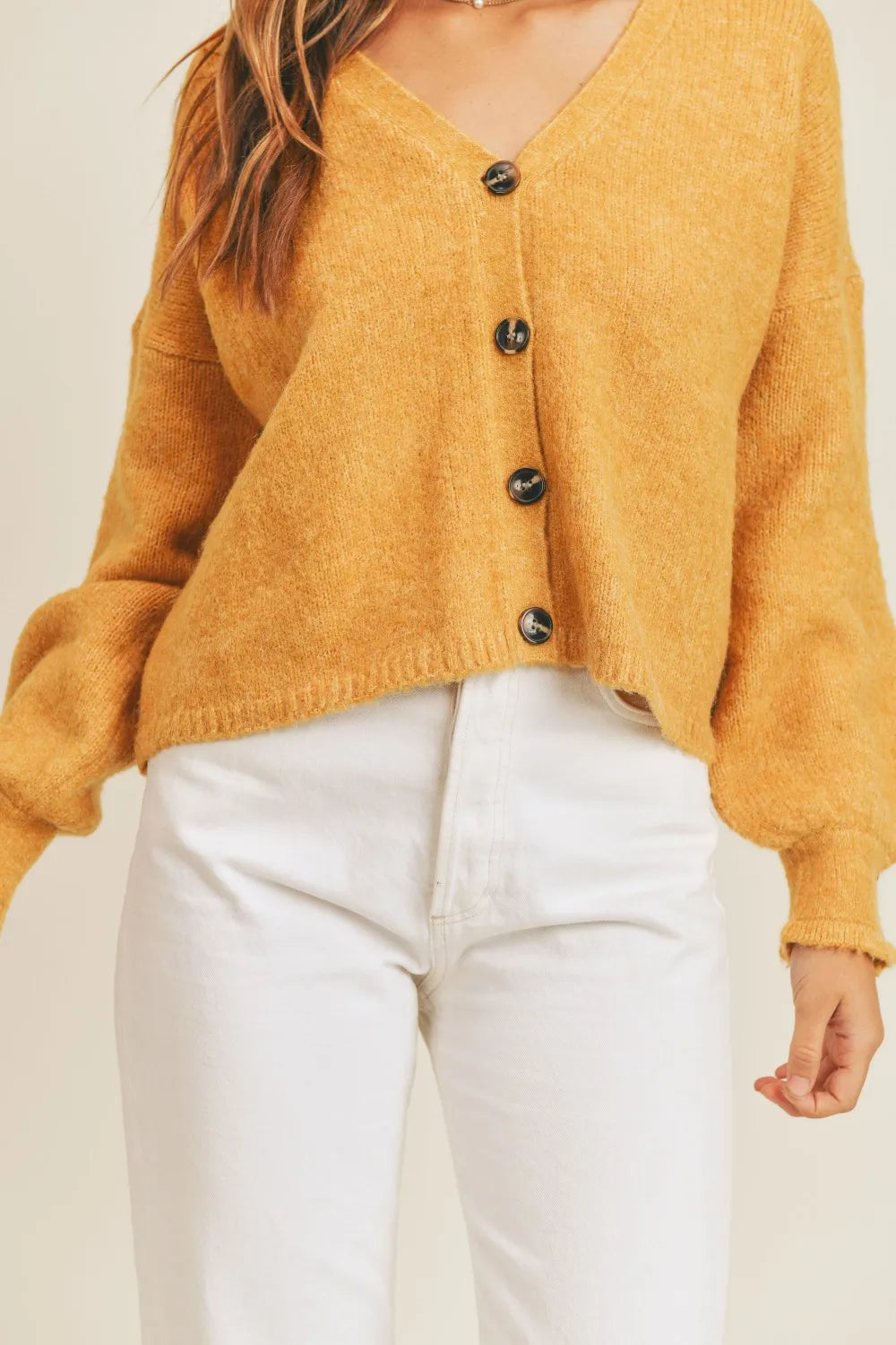Cropped v-neck balloon sleeve in mustard, close-up detail