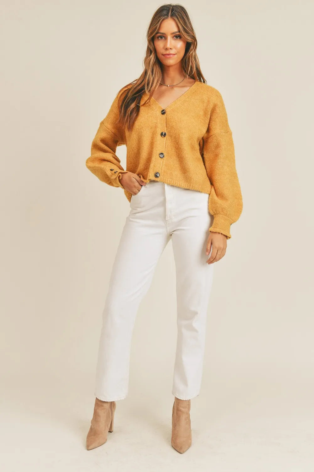 Cropped v-neck balloon sleeve in mustard, styled on model 2