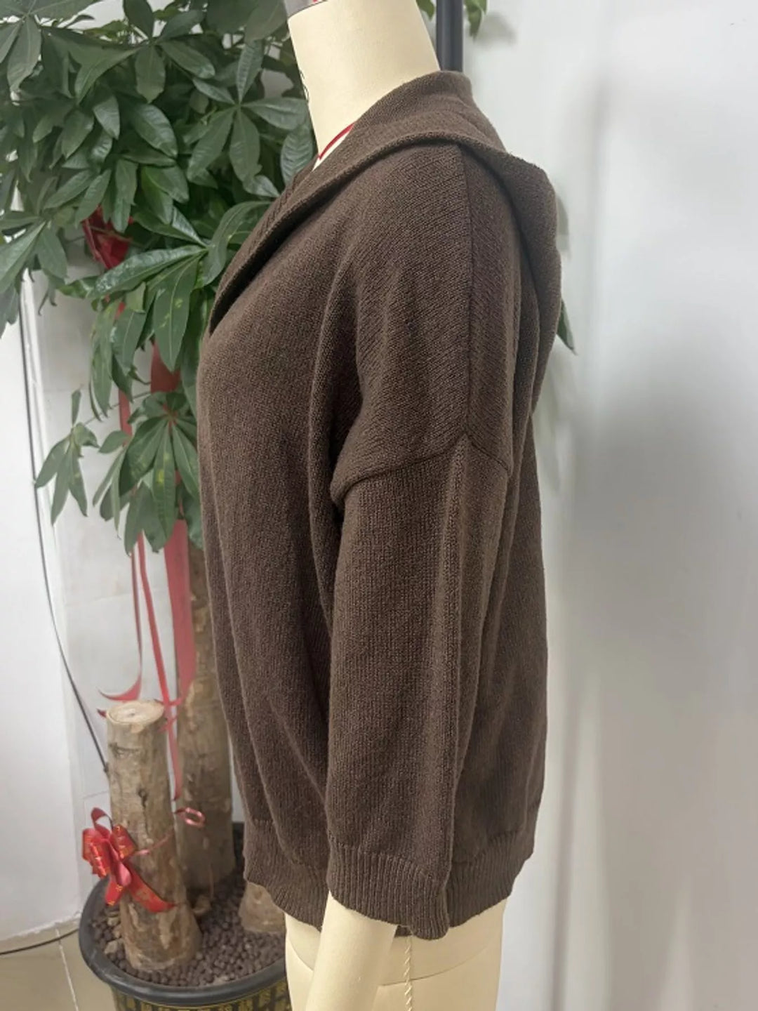 Hooded open front drop shoulder in brown, styled on model 2