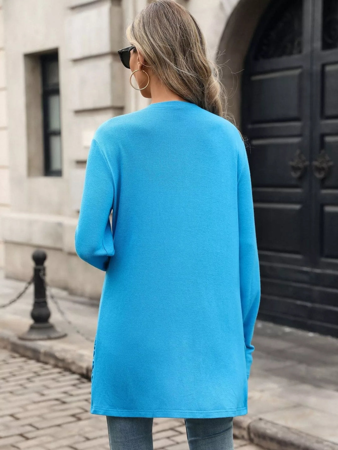 Open front waterfall drape thumbholes in blue, back view