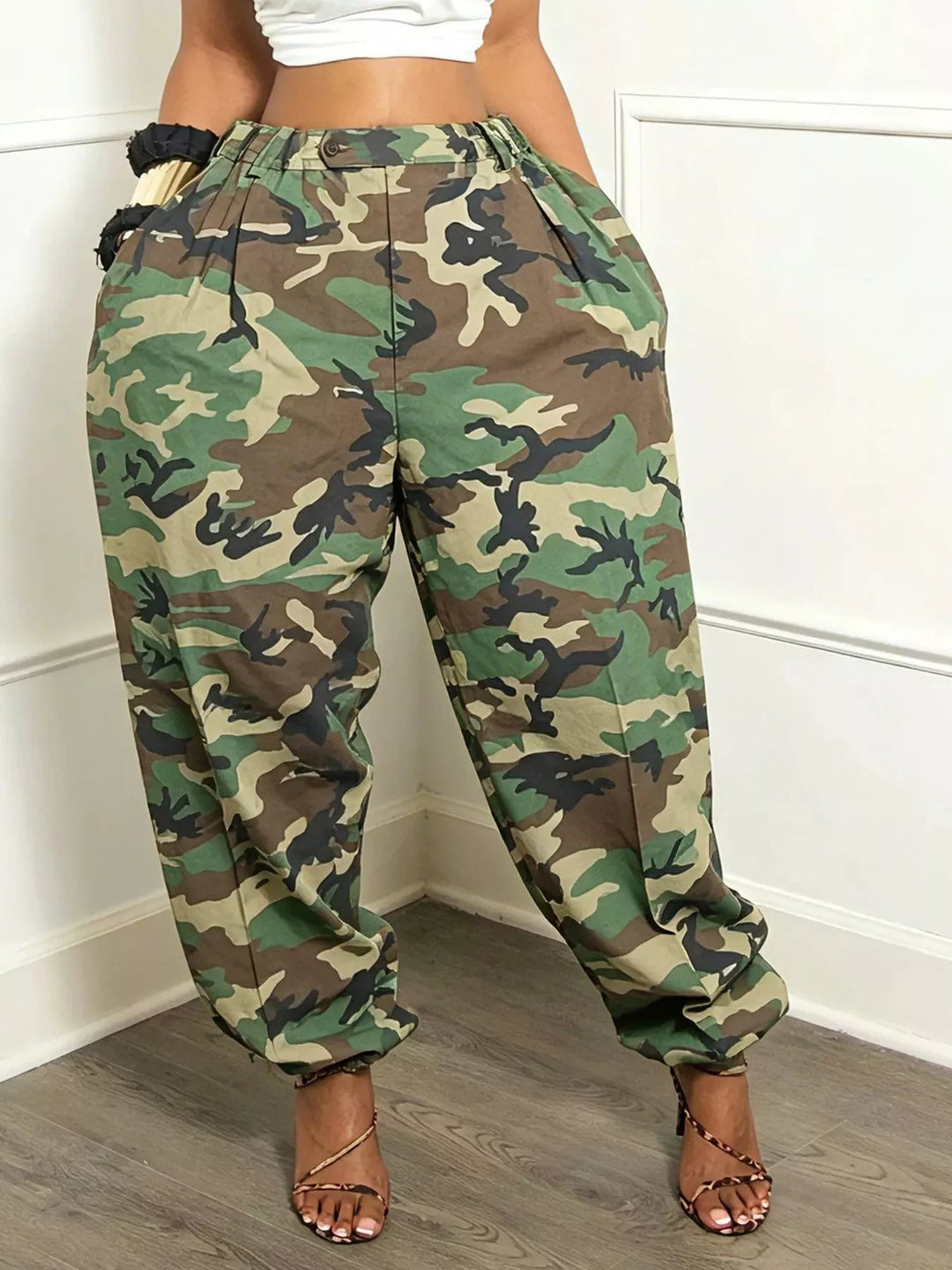 Close-up of camo print cargo pants showing the baggy leg and ankle cuff