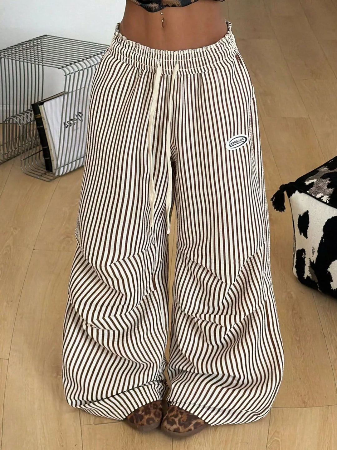 Brown stripe cargo pants with gathered hem, standing front view
