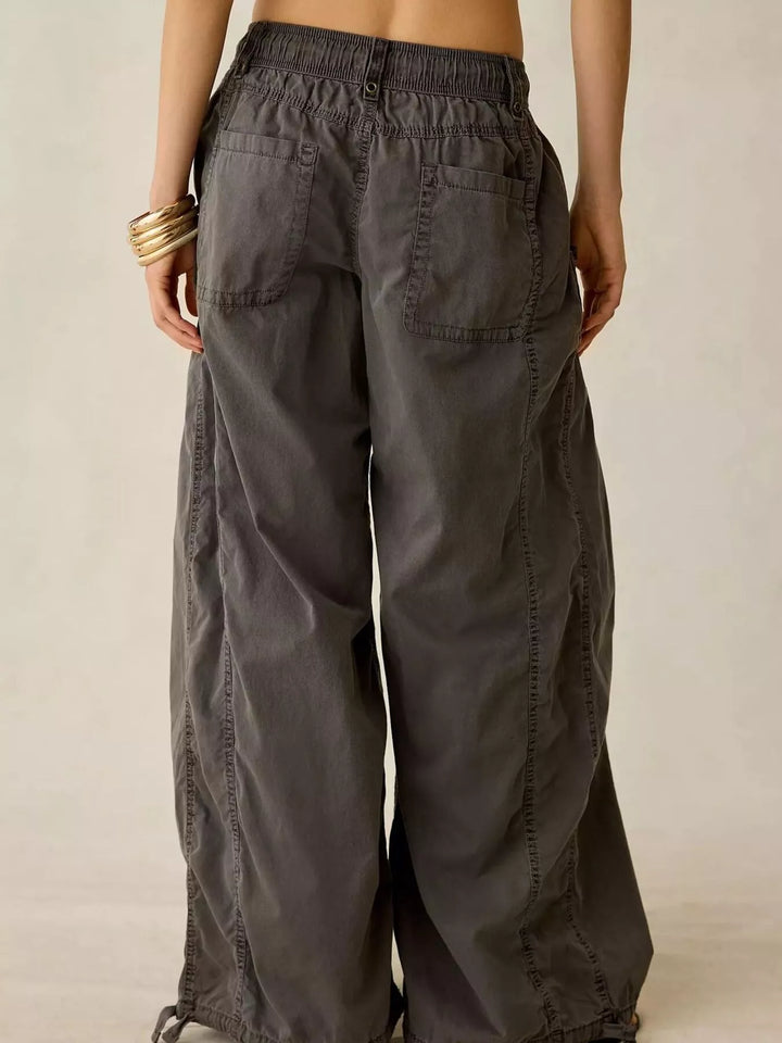 Back view of the charcoal wide leg cargo pants with patch pocket