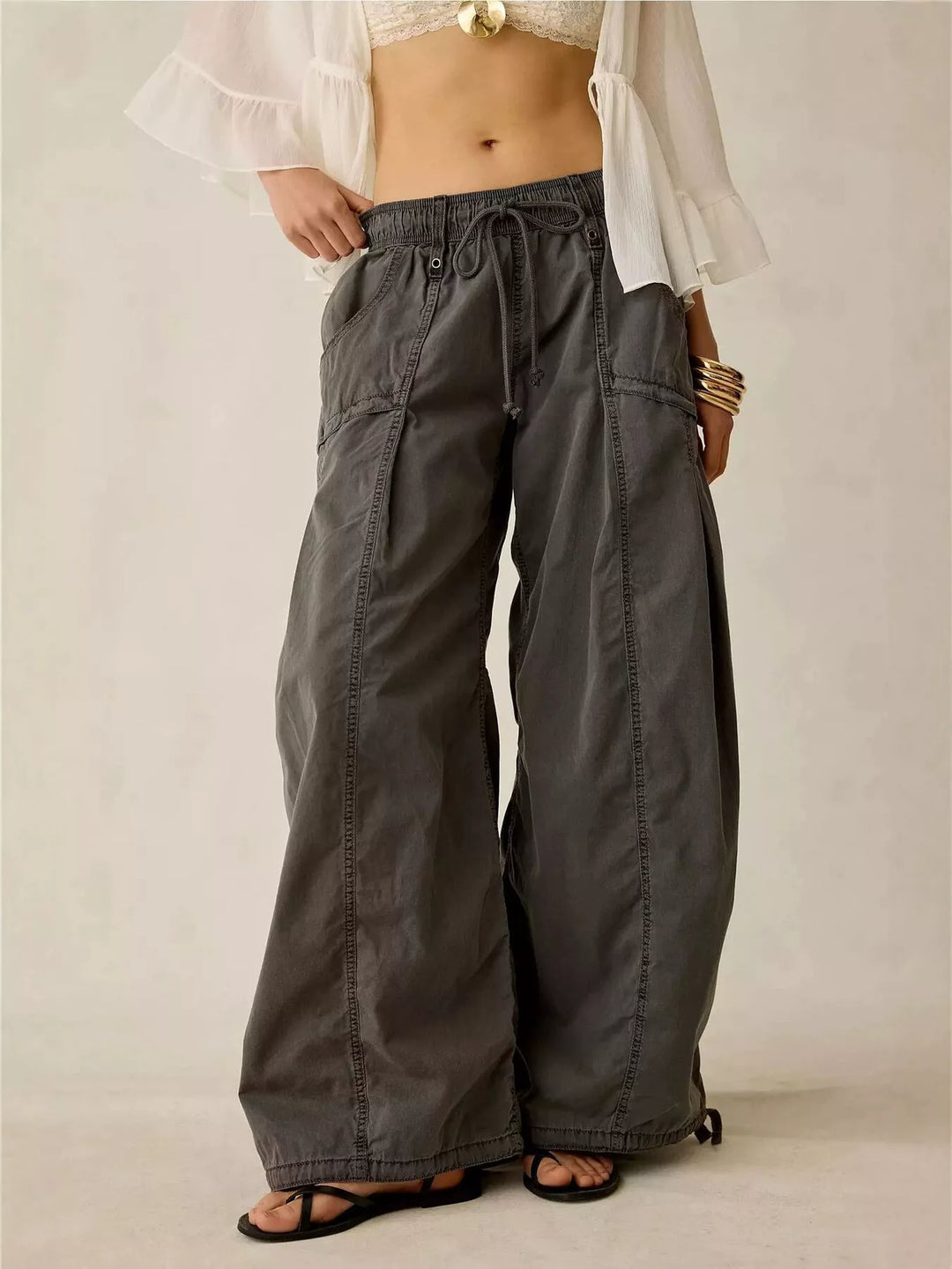Women's cargo pants in charcoal, wide leg parachute style with drawstring waist, front view
