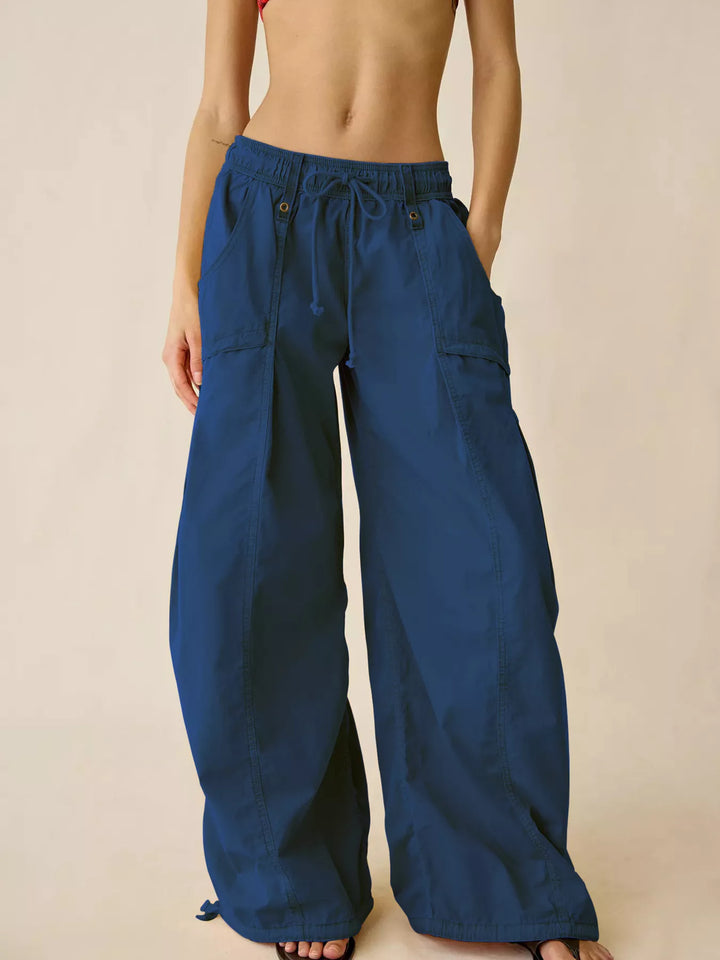 Cobalt blue wide leg cargo pants with drawstring waist, front view