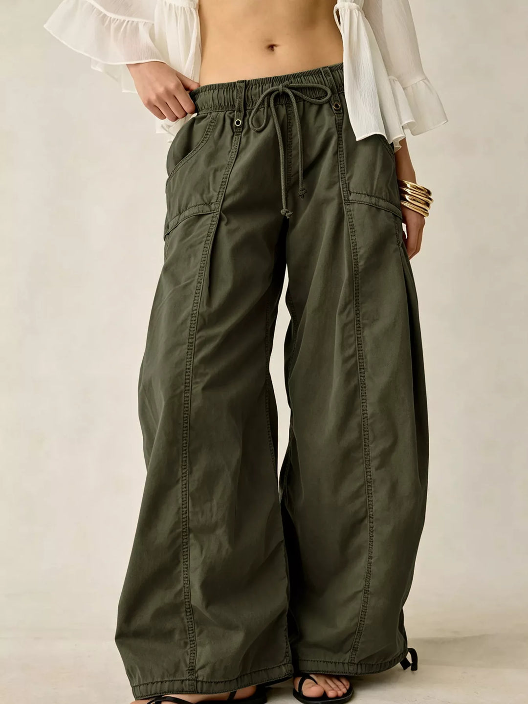 Olive wide leg parachute cargo pants with drawstring waist, front view