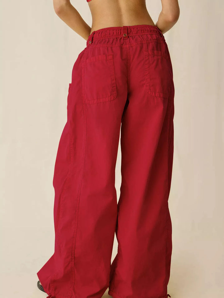 Back view of the red wide leg cargo pants with drawstring hem