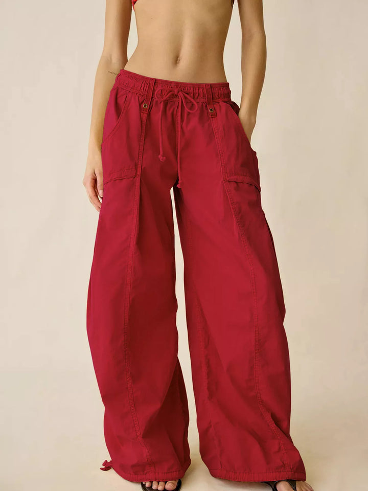 Red wide leg parachute cargo pants with drawstring waist, front view