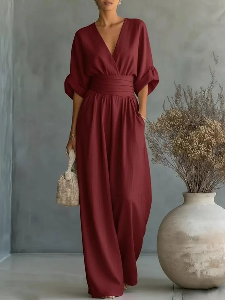 Burgundy wrap jumpsuit with deep V neck and half sleeves, front view