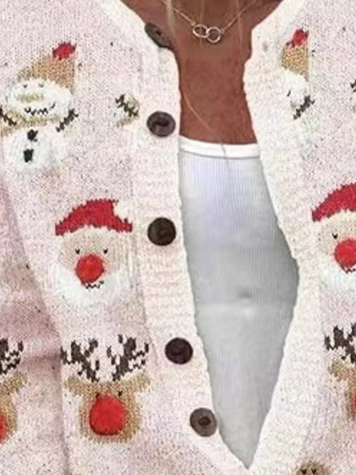 Close-up of the blush pink cardigan Santa and snowman designs and brown buttons
