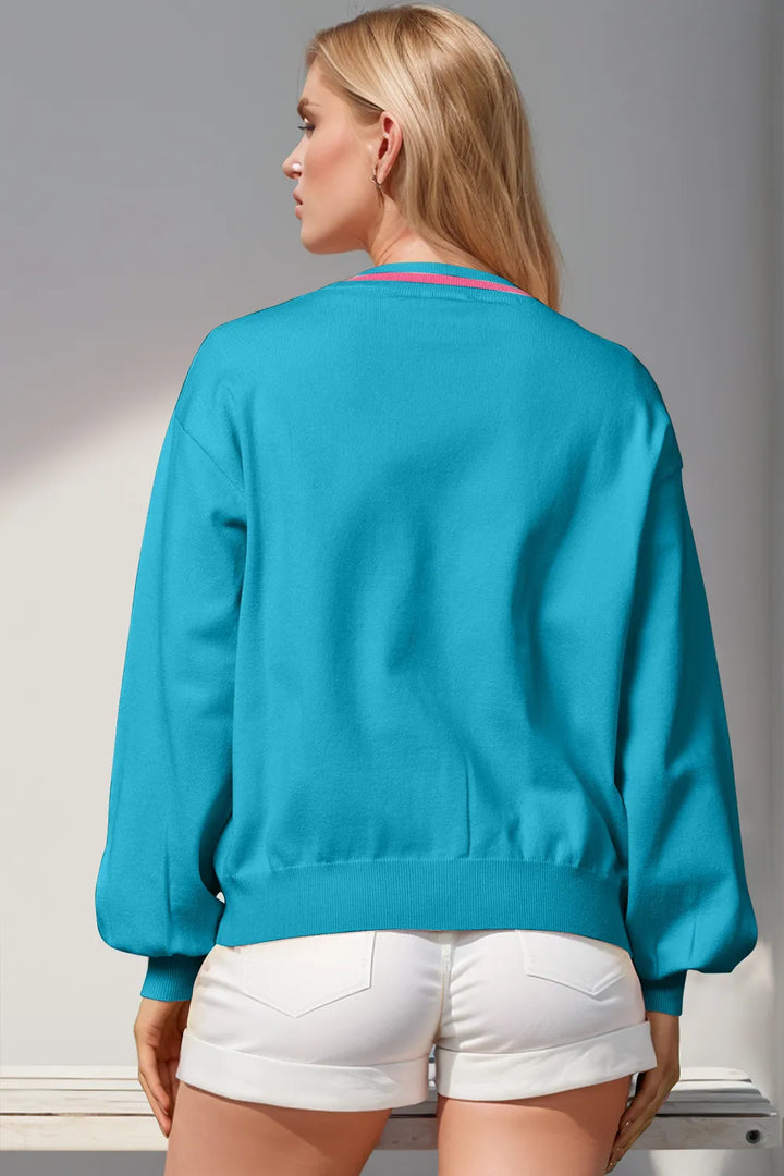 Back view of the turquoise V neck cardigan with gathered cuffs