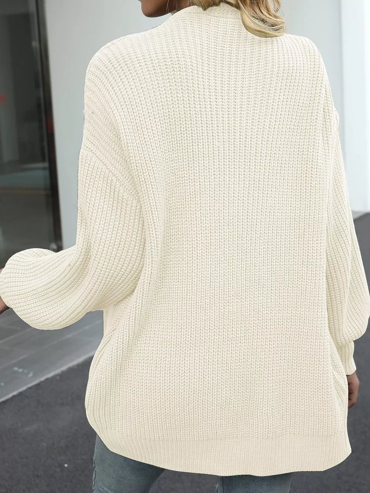 Back view of the cream chunky knit cardigan with a ribbed texture