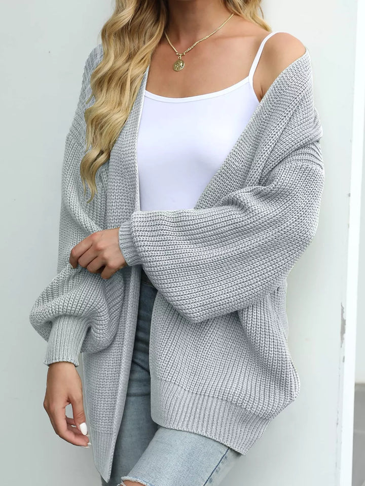 Light gray oversized batwing cardigan in a side view with a loose sleeve