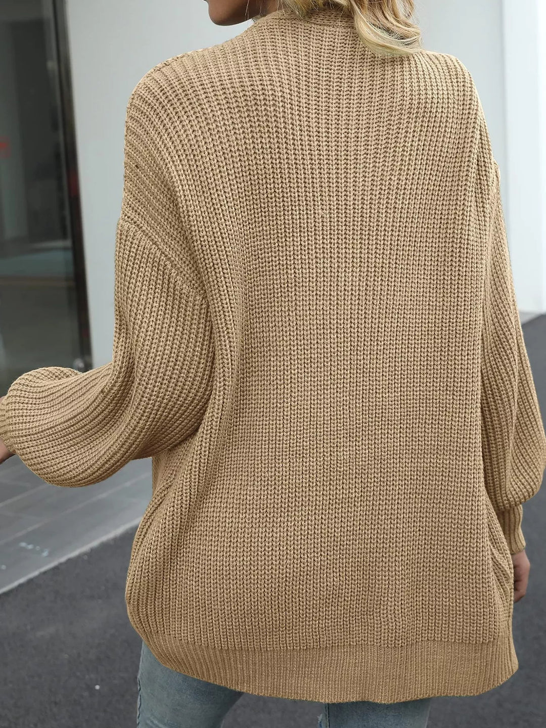 Back view of the tan chunky knit cardigan with ribbed texture