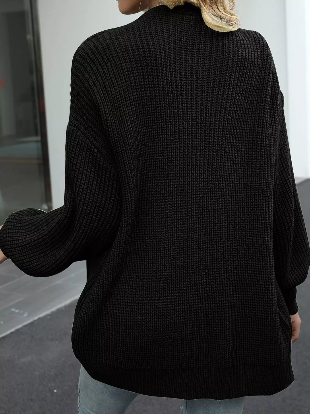 Back view of the black oversized chunky knit cardigan
