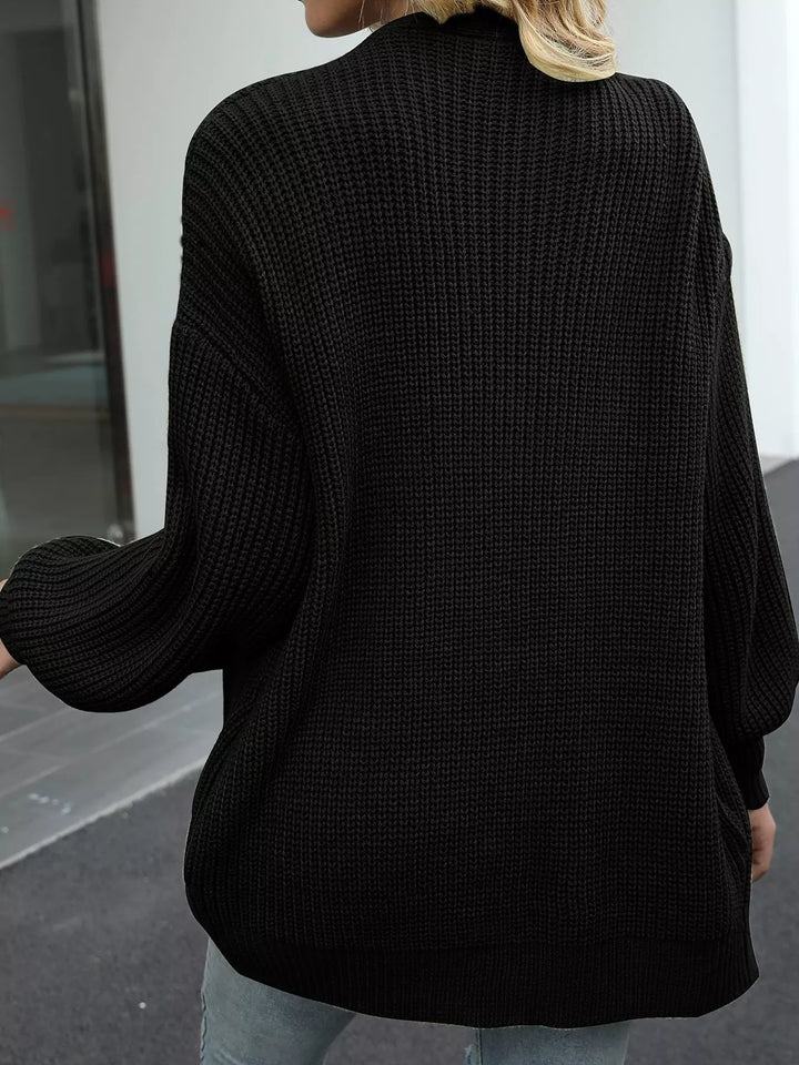 Back view of the black oversized chunky knit cardigan