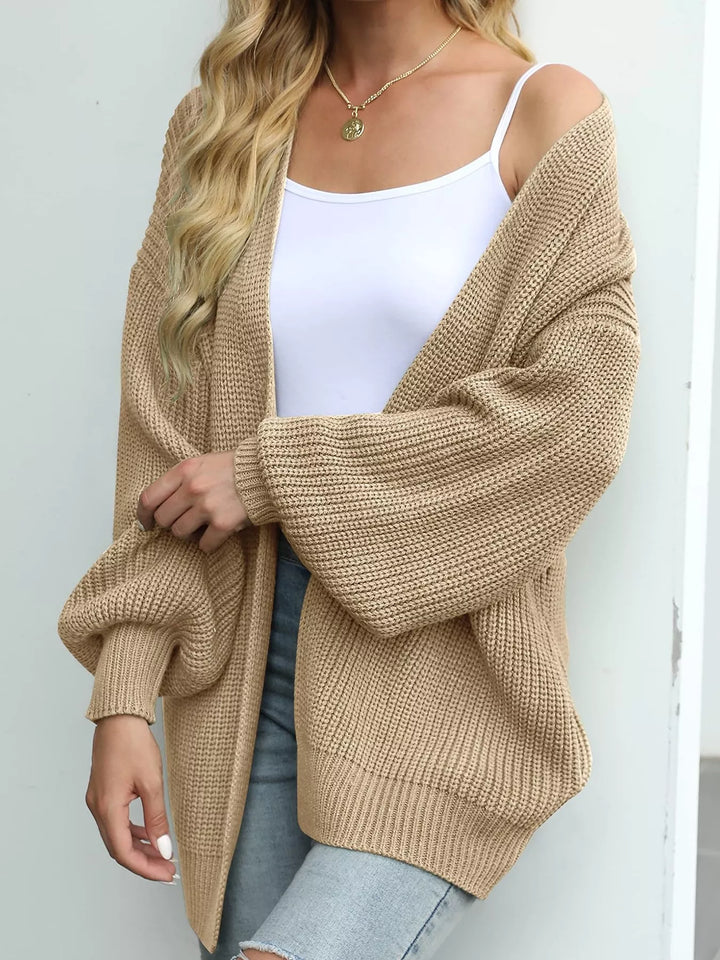 Camel open front cardigan with lantern sleeves, side angle over a white tank