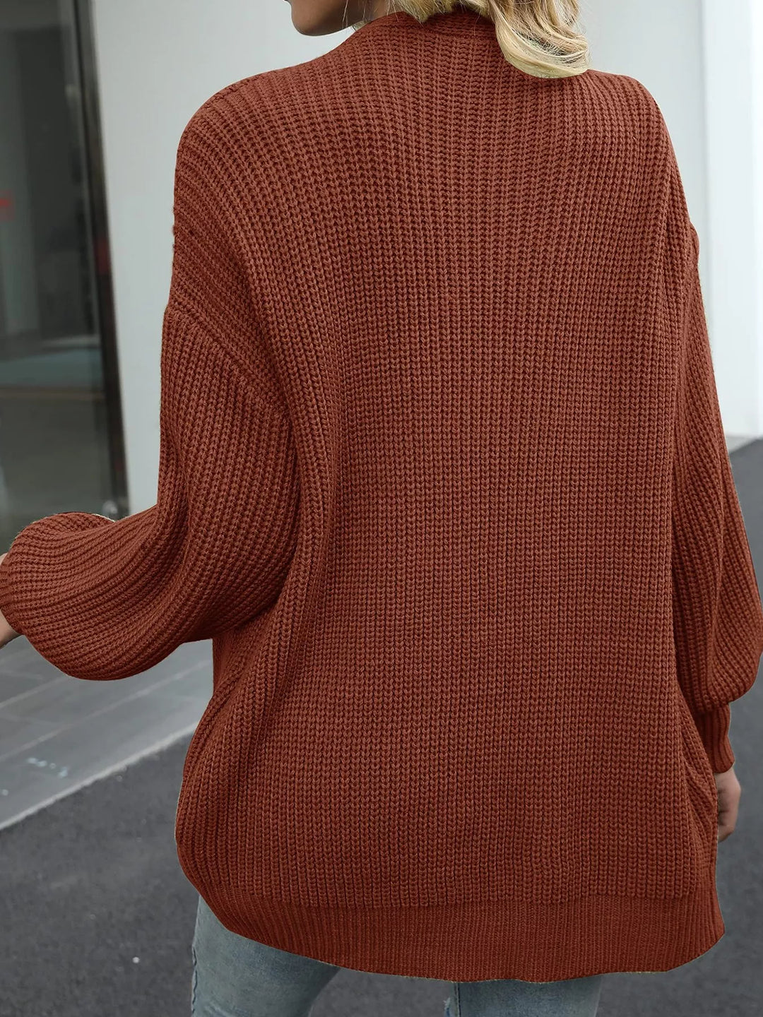 Back view of the rust oversized chunky knit cardigan