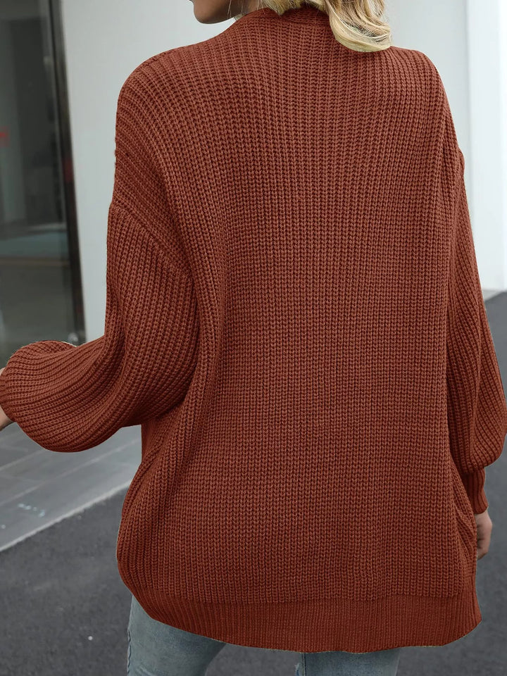 Back view of the rust oversized chunky knit cardigan
